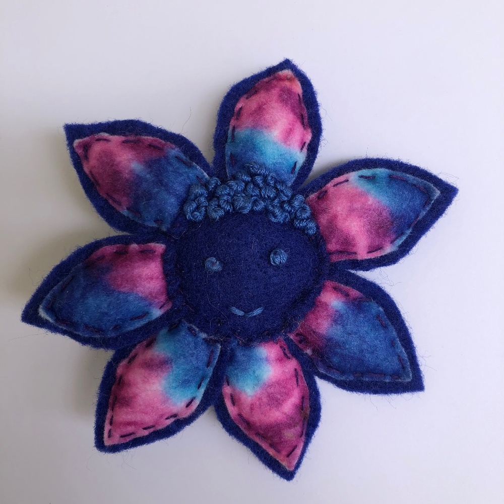 Hand-sewn Happy Face Flower Pin in blue pink tie-dye